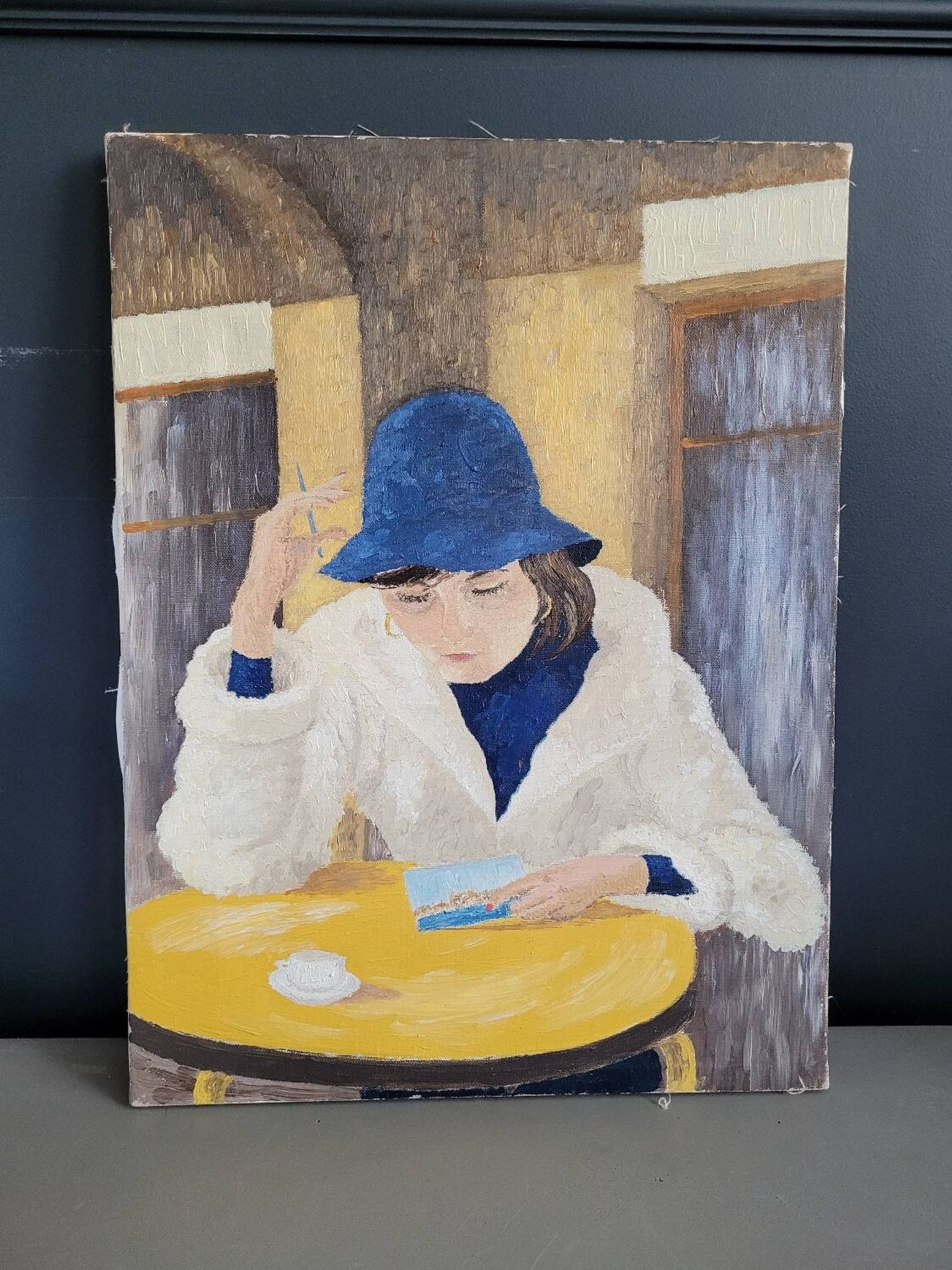 Oil on canvas portrait of a woman writing a postcard
