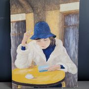 Oil on canvas portrait of a woman writing a postcard