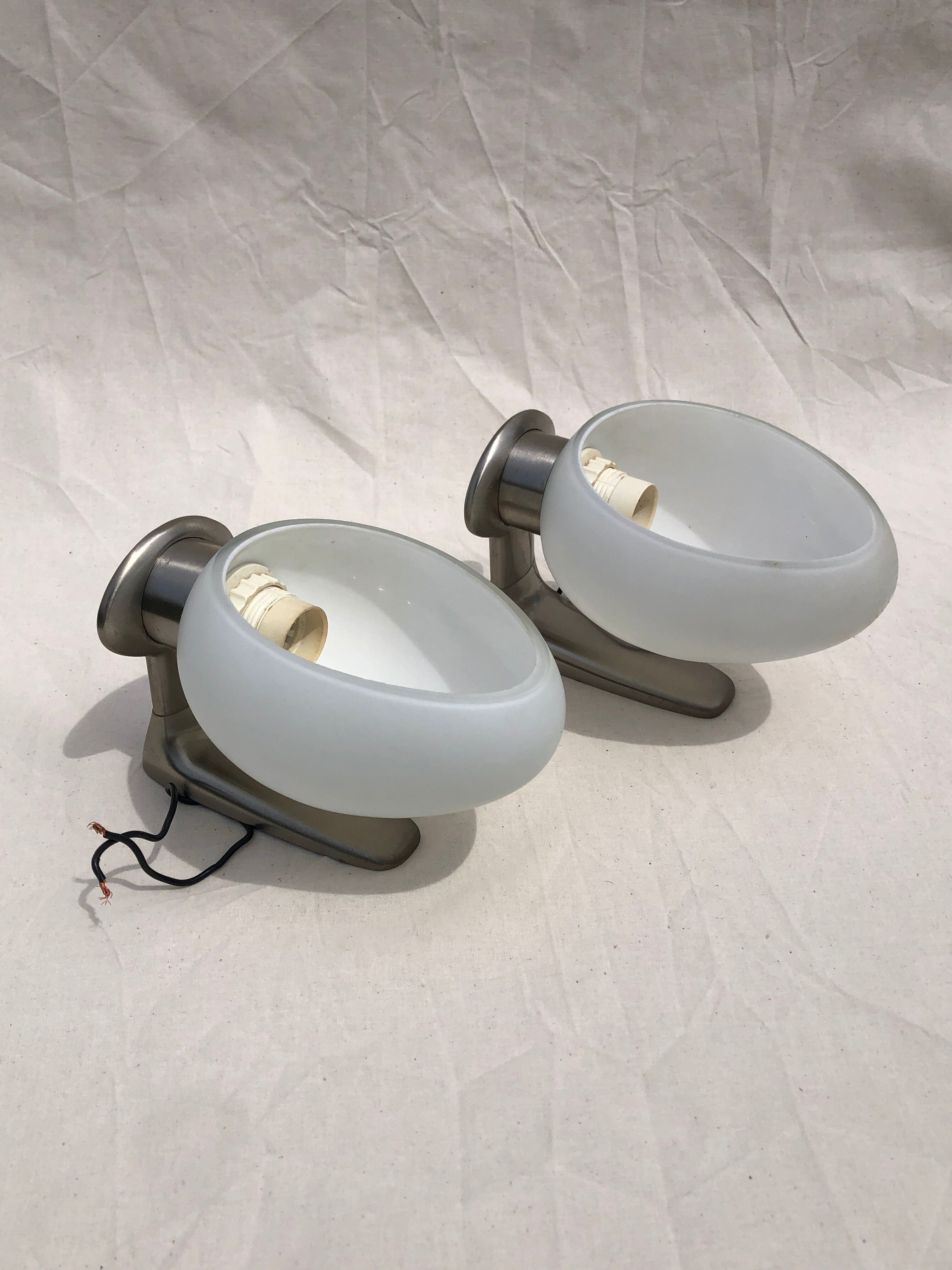 Pair of brushed steel appliques, half-egg opaline, 1970