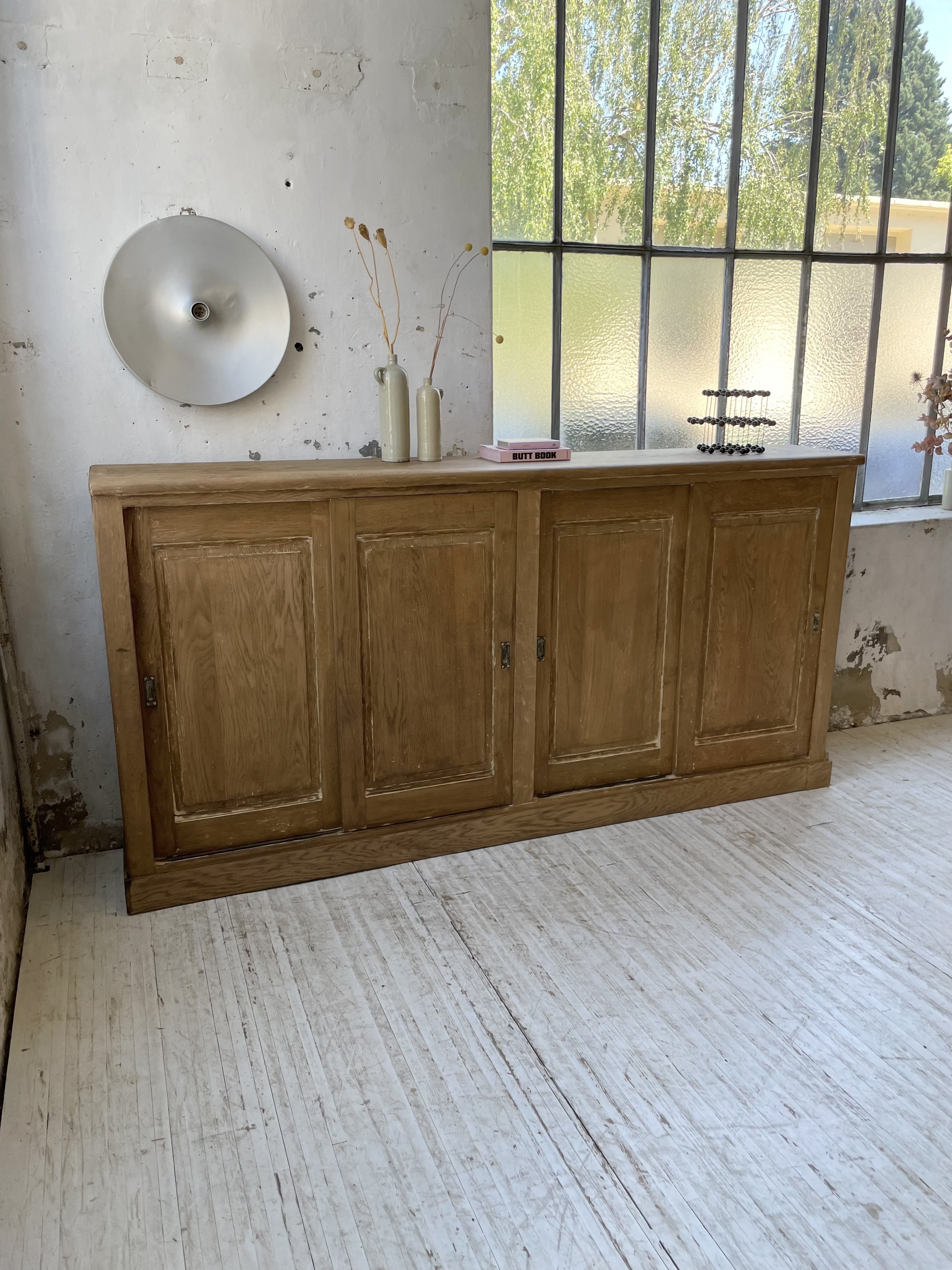 Large row of solid oak loom sliding doors