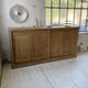 Large row of solid oak loom sliding doors