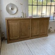 Large row of solid oak loom sliding doors