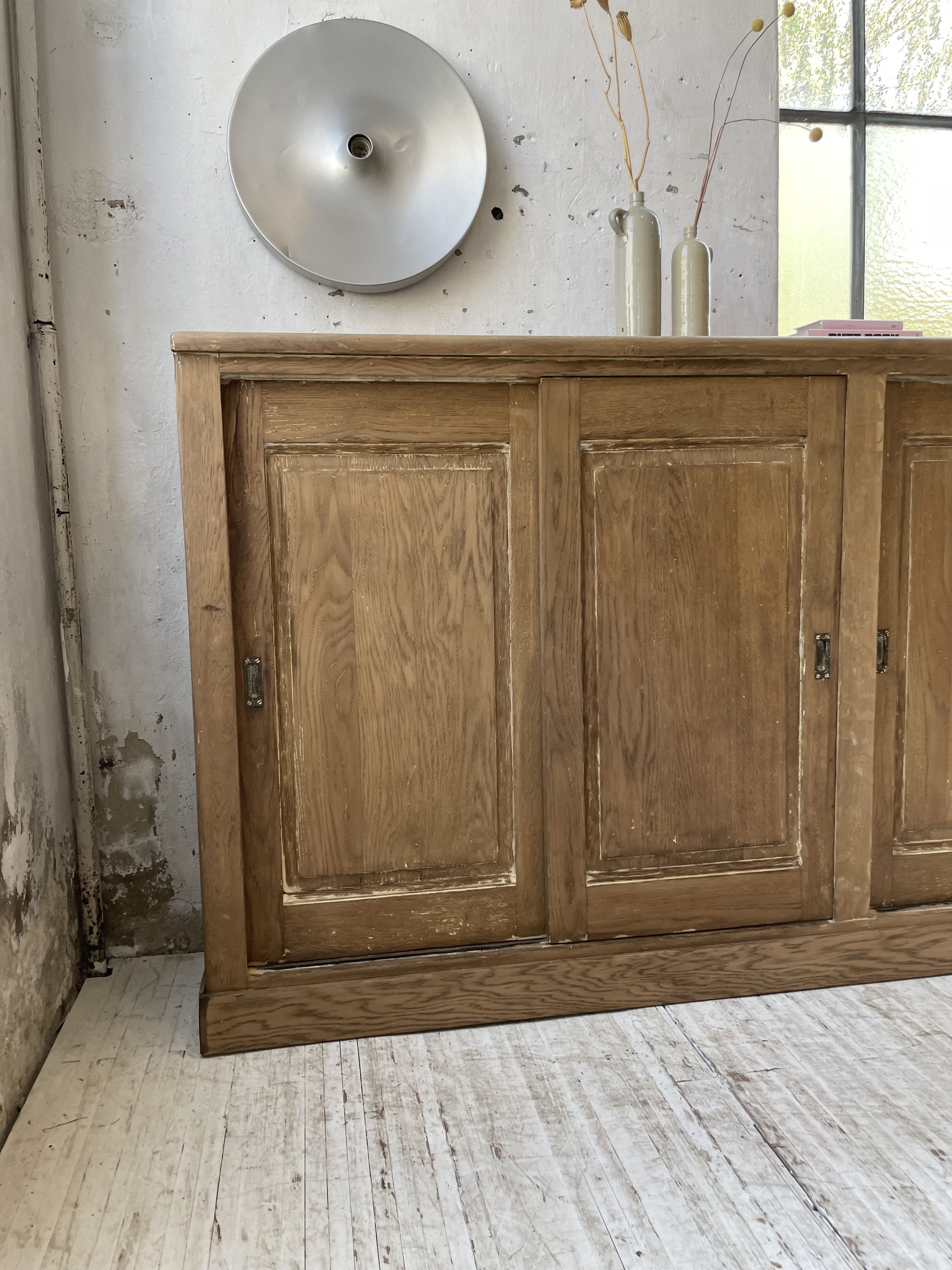 Large row of solid oak loom sliding doors