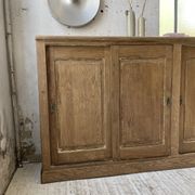Large row of solid oak loom sliding doors