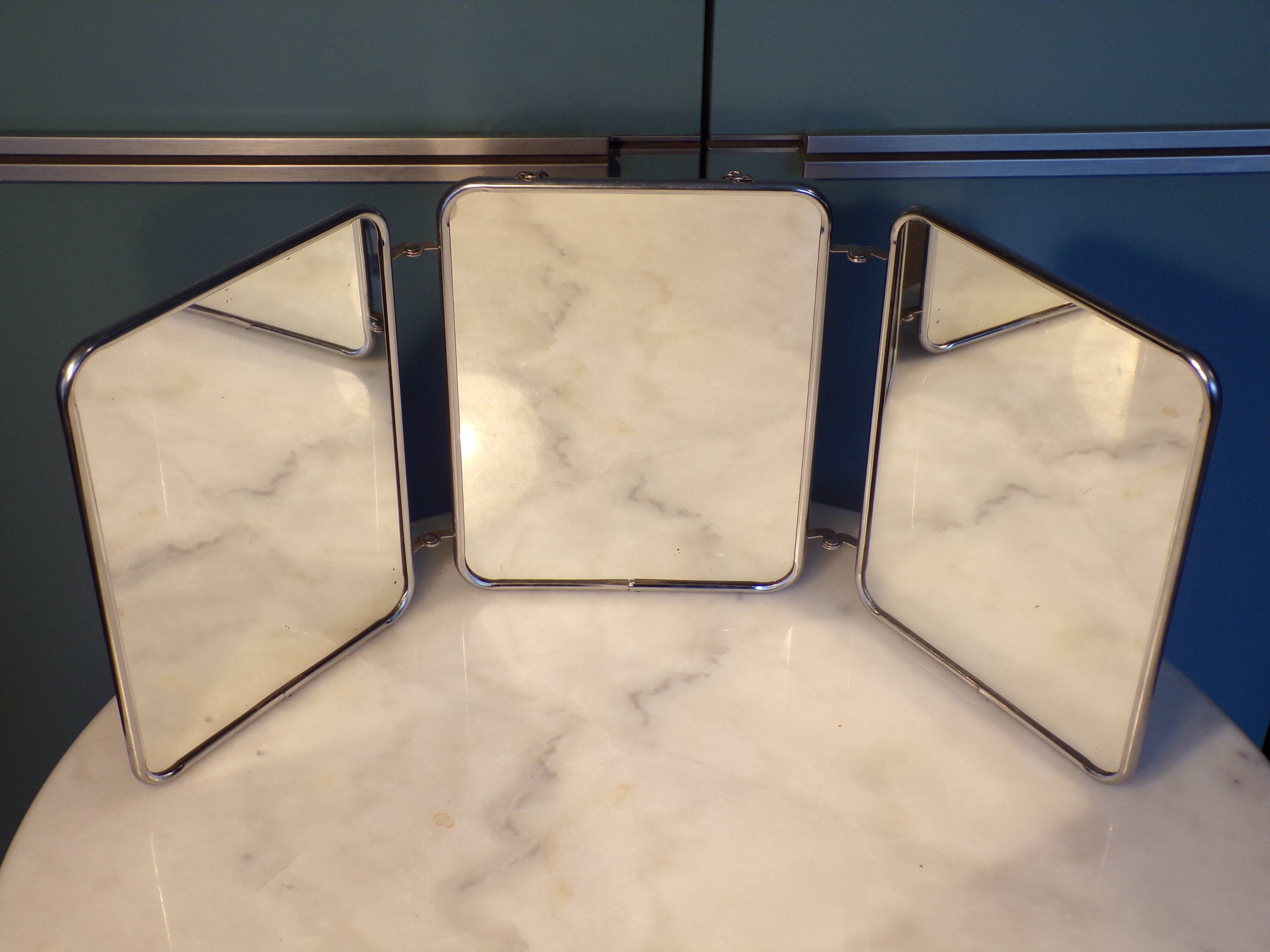 Triptych mirror with chain.