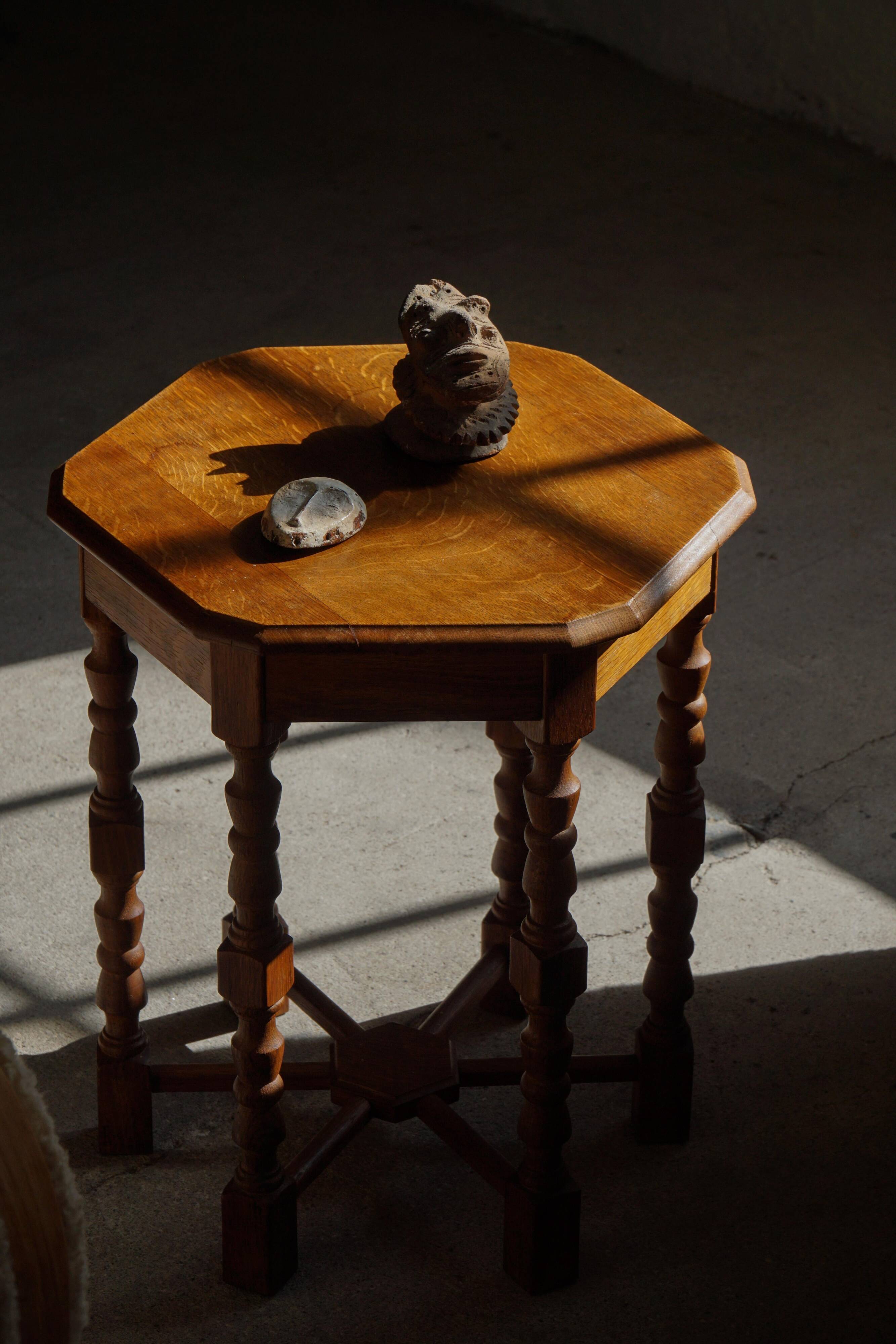 Danish hexagonal side table in oak with turned legs, 1950s.