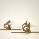 Pair of two-armed Empire wall sconces in gilded bronze