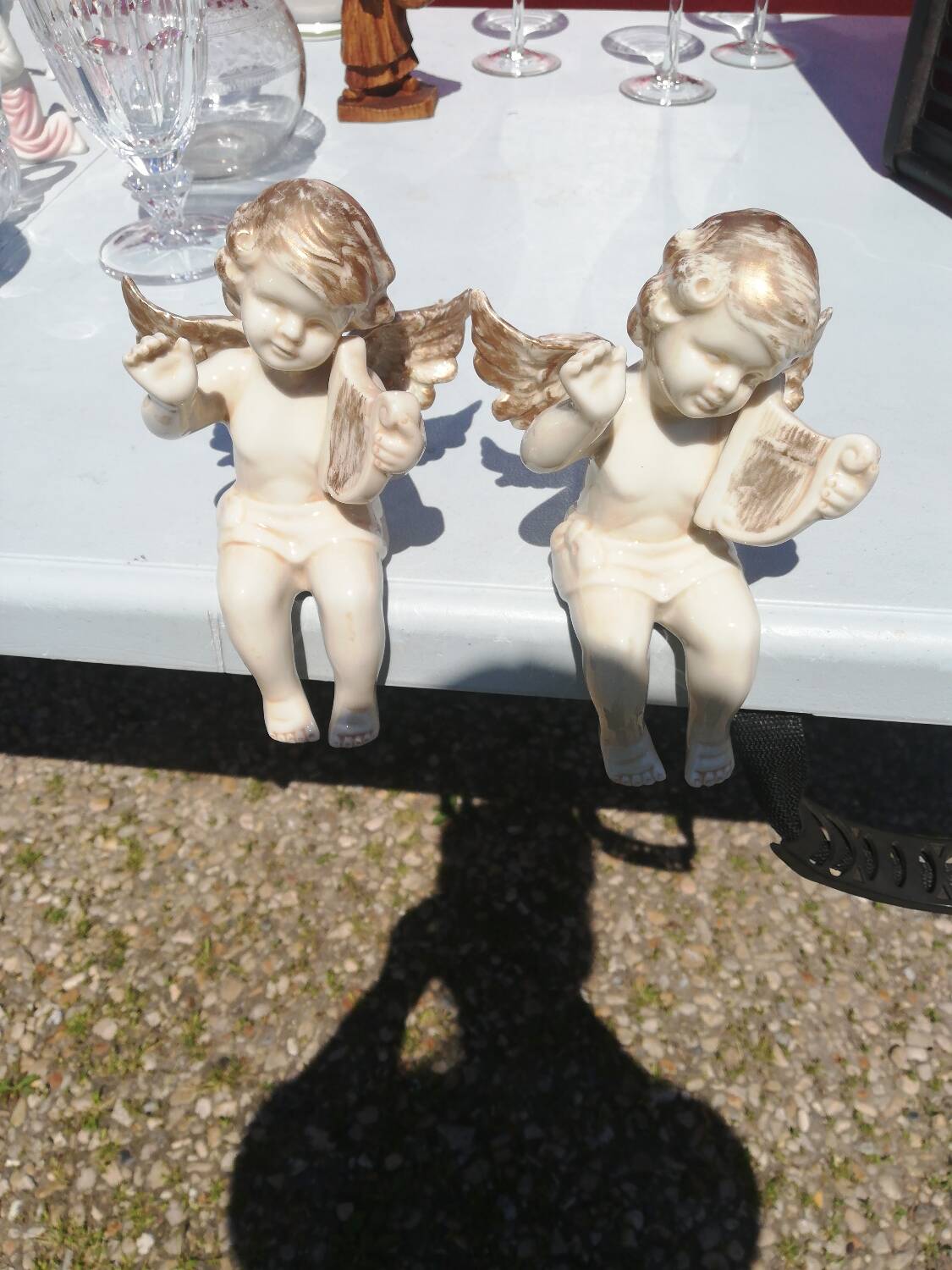 Pair of sitting angel statuettes