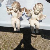 Pair of sitting angel statuettes