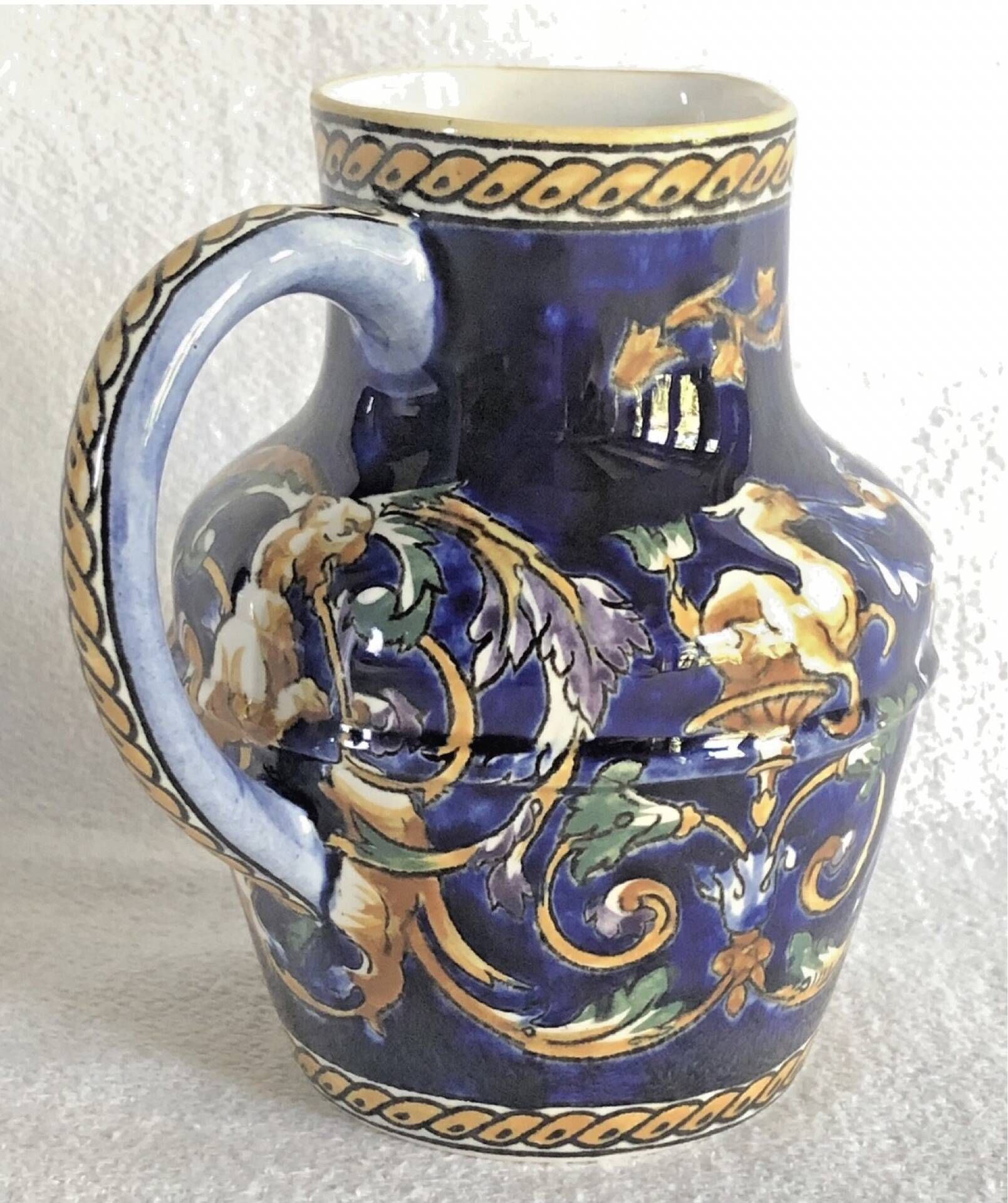 Old cream jug Gien Renaissance blue background 1938/1960