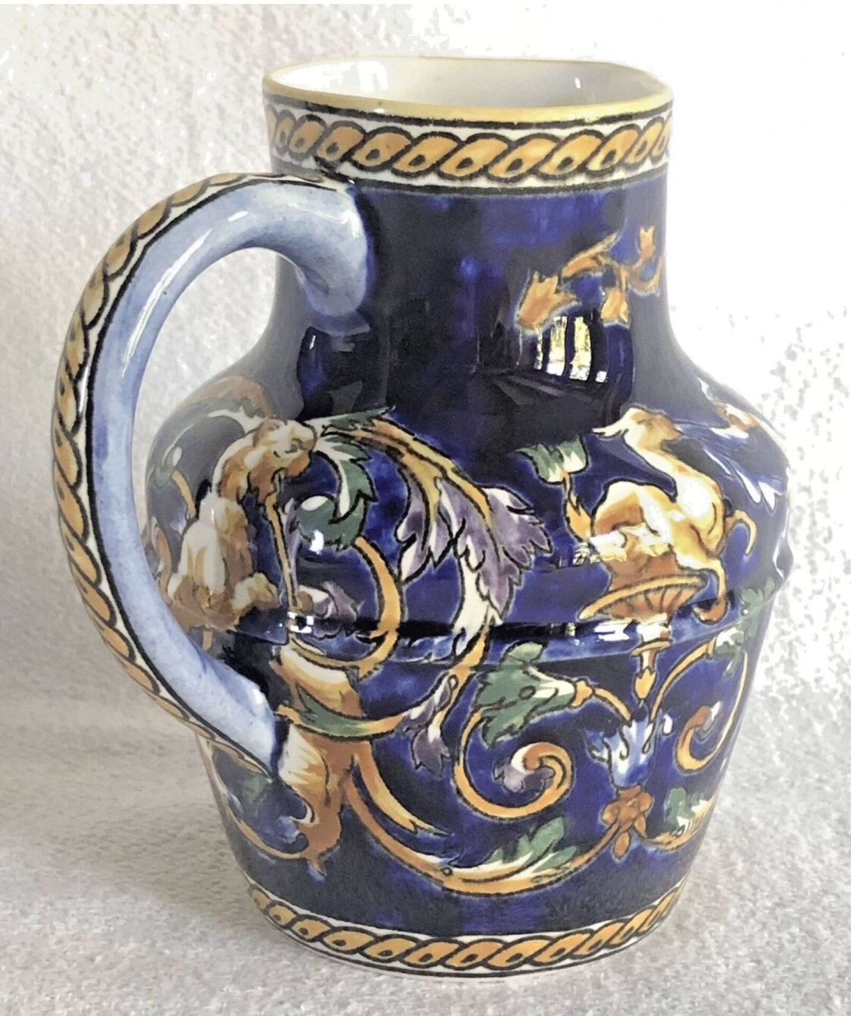 Old cream jug Gien Renaissance blue background 1938/1960