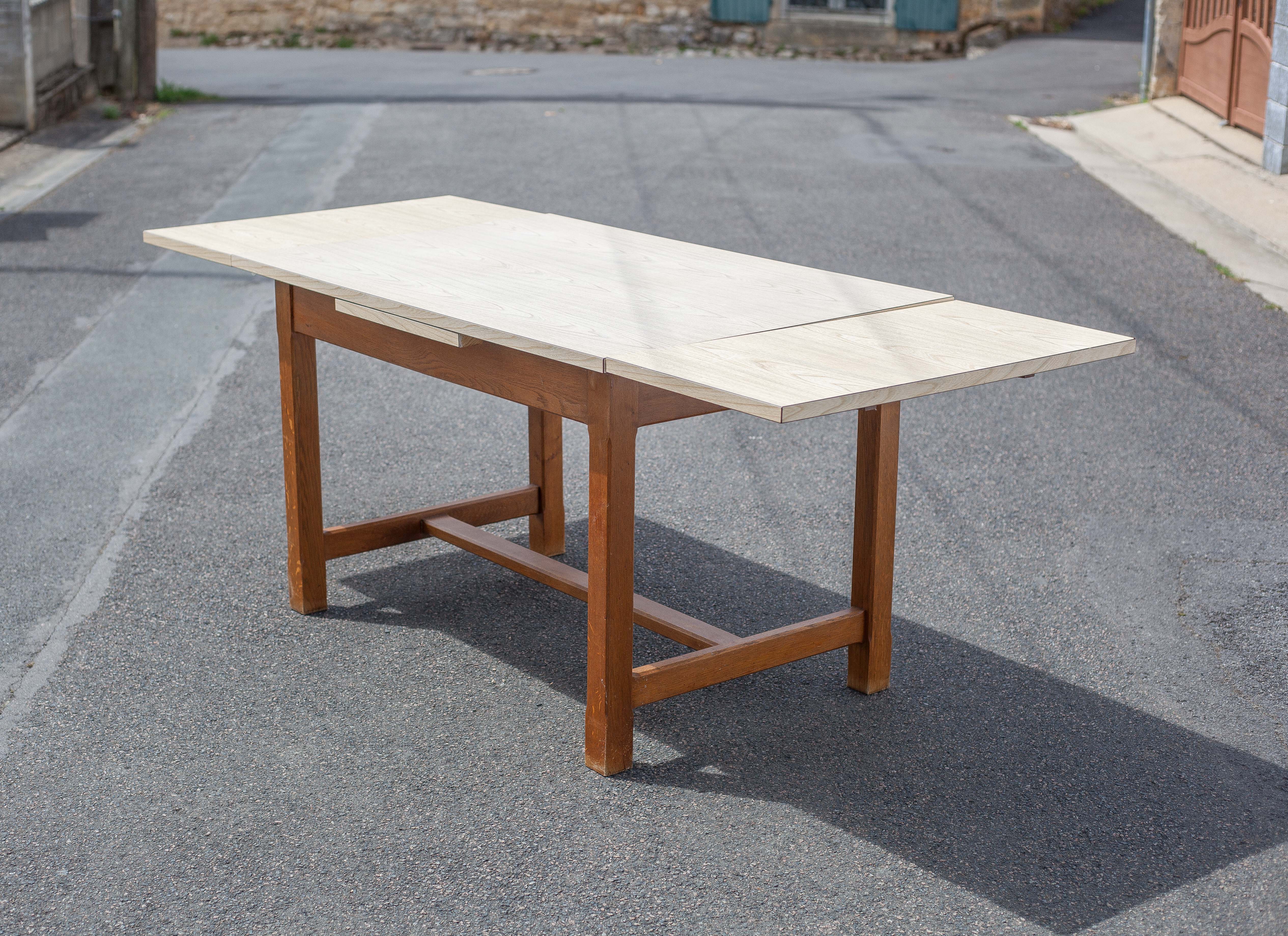 Wood and formica table with extensions