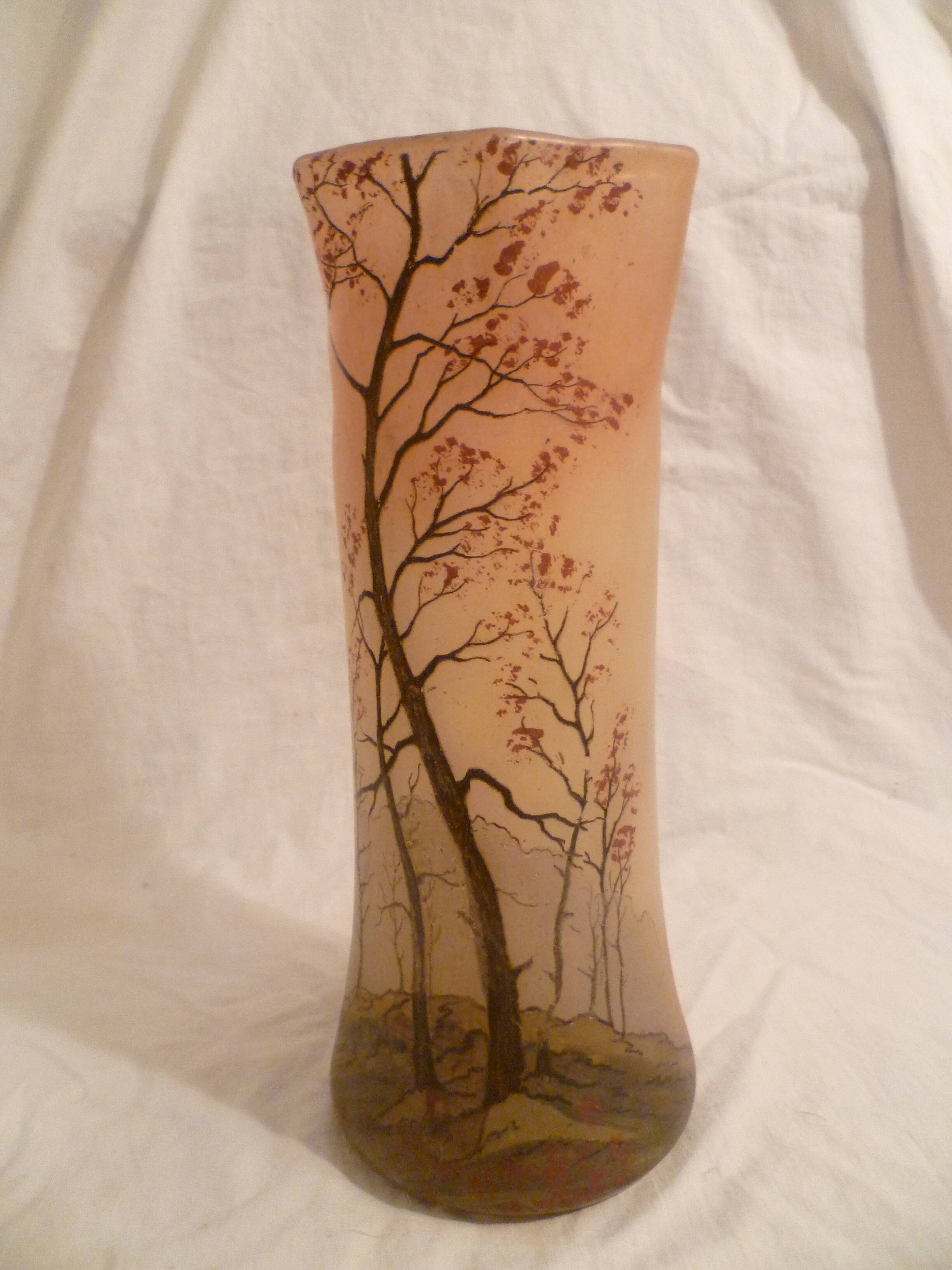 Blown glass vase with painted underbrush decoration marked "leg"