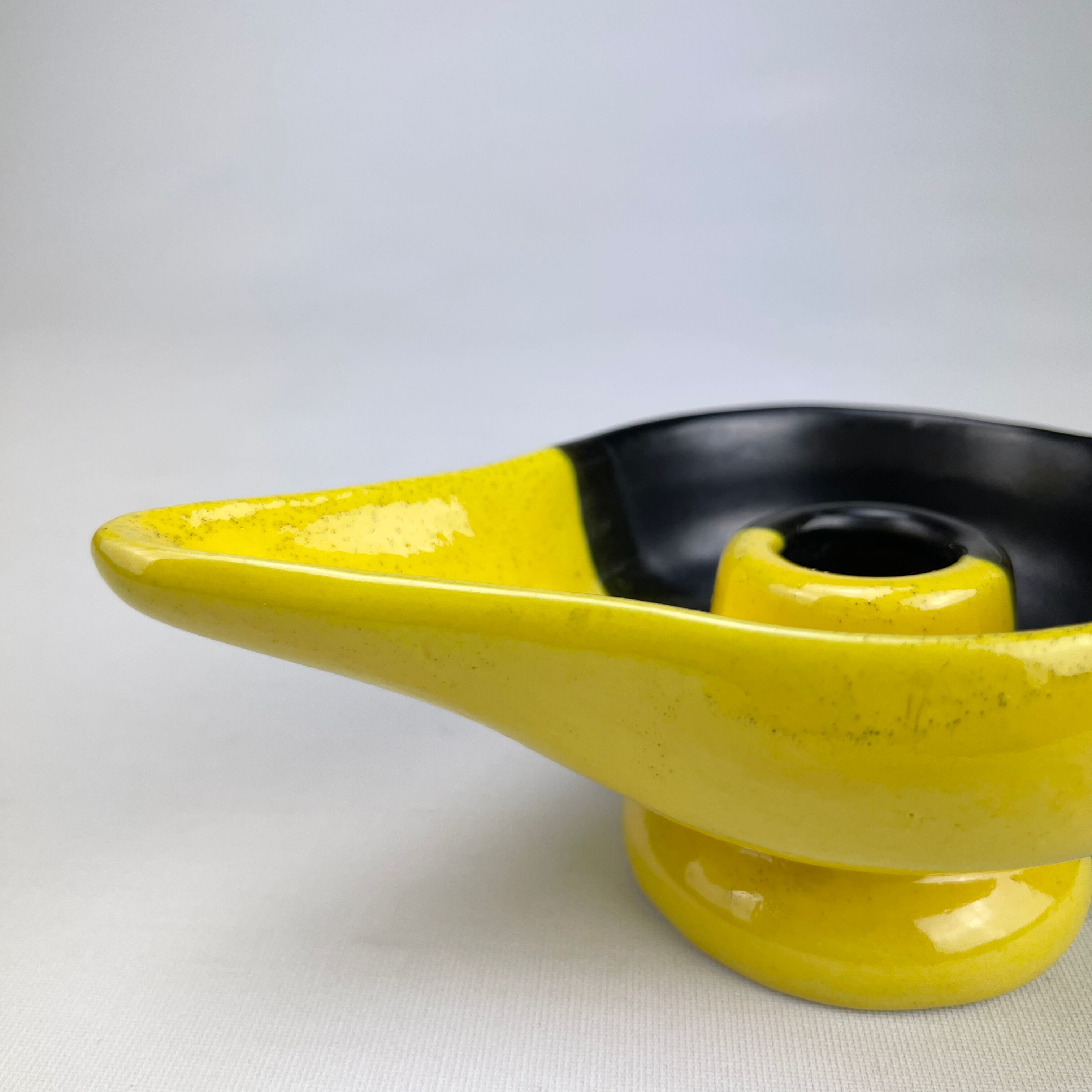 Mid-century yellow and black ceramic cellar rat candle holder