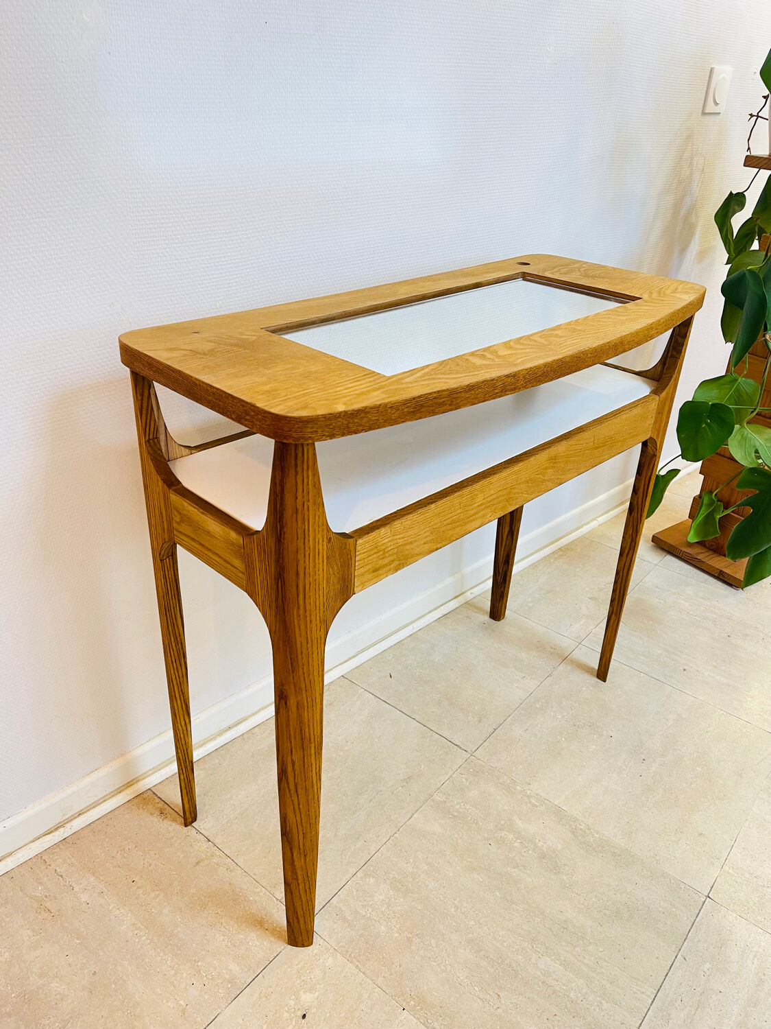 Small contemporary console in stained walnut wood.