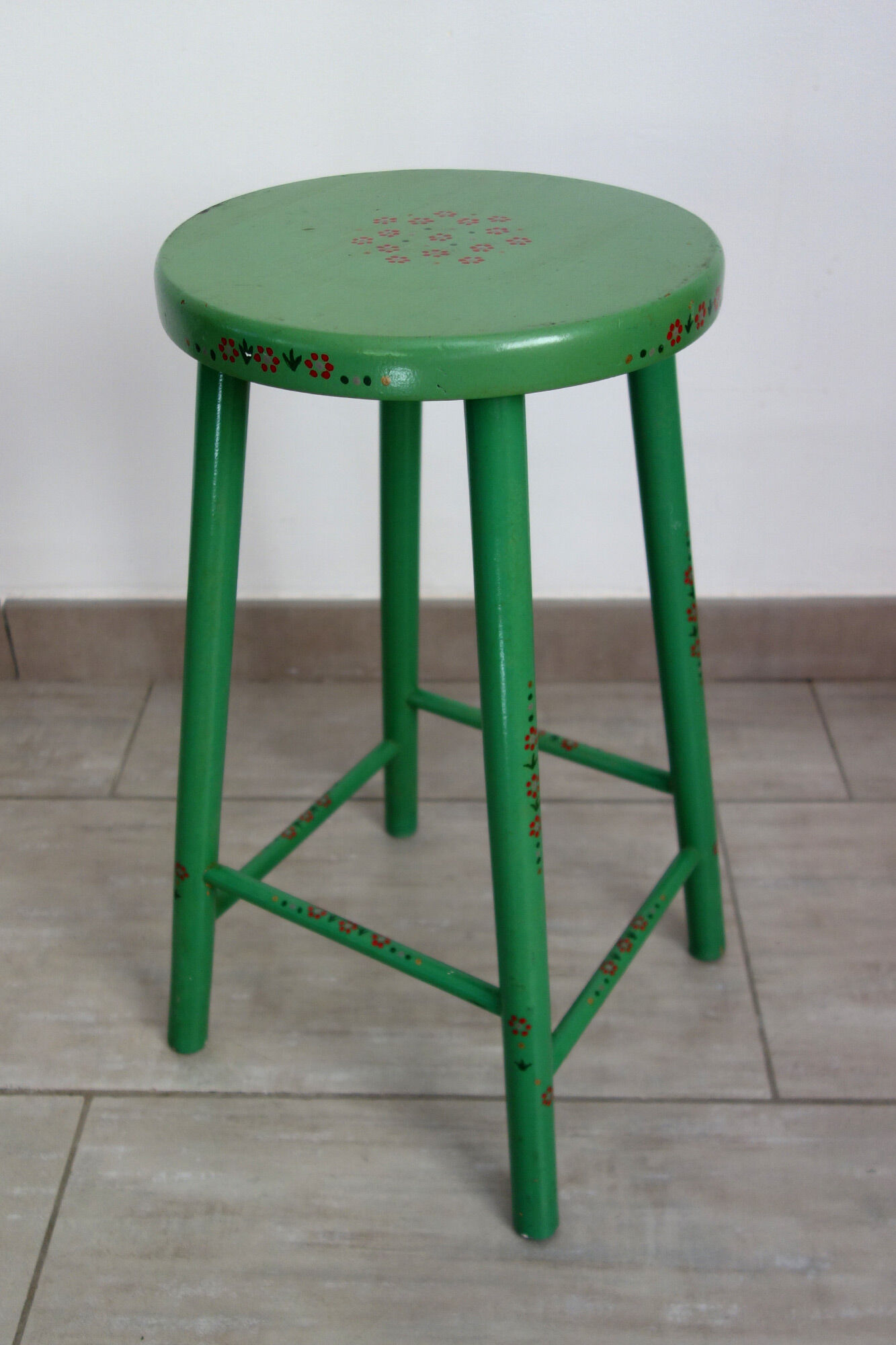 Old painted and decorated wooden stool
