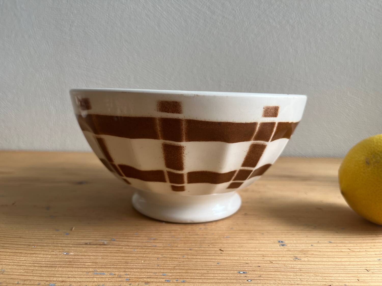 Antique faceted bowl on earthenware pedestal