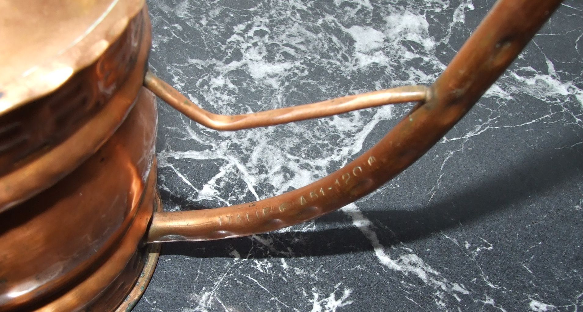 Old copper watering can