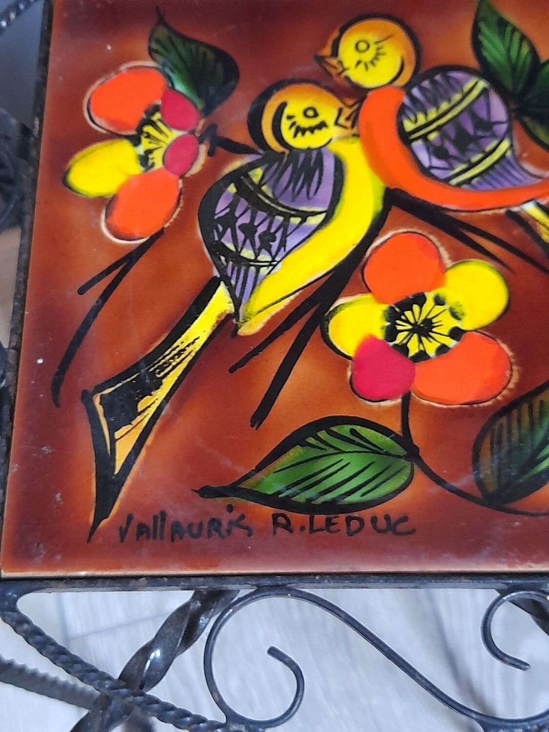 Wrought iron stool and Vallauris pottery signed Leduc.