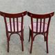 2 burgundy curved wooden bistro chairs from Ets Joseph Levallois