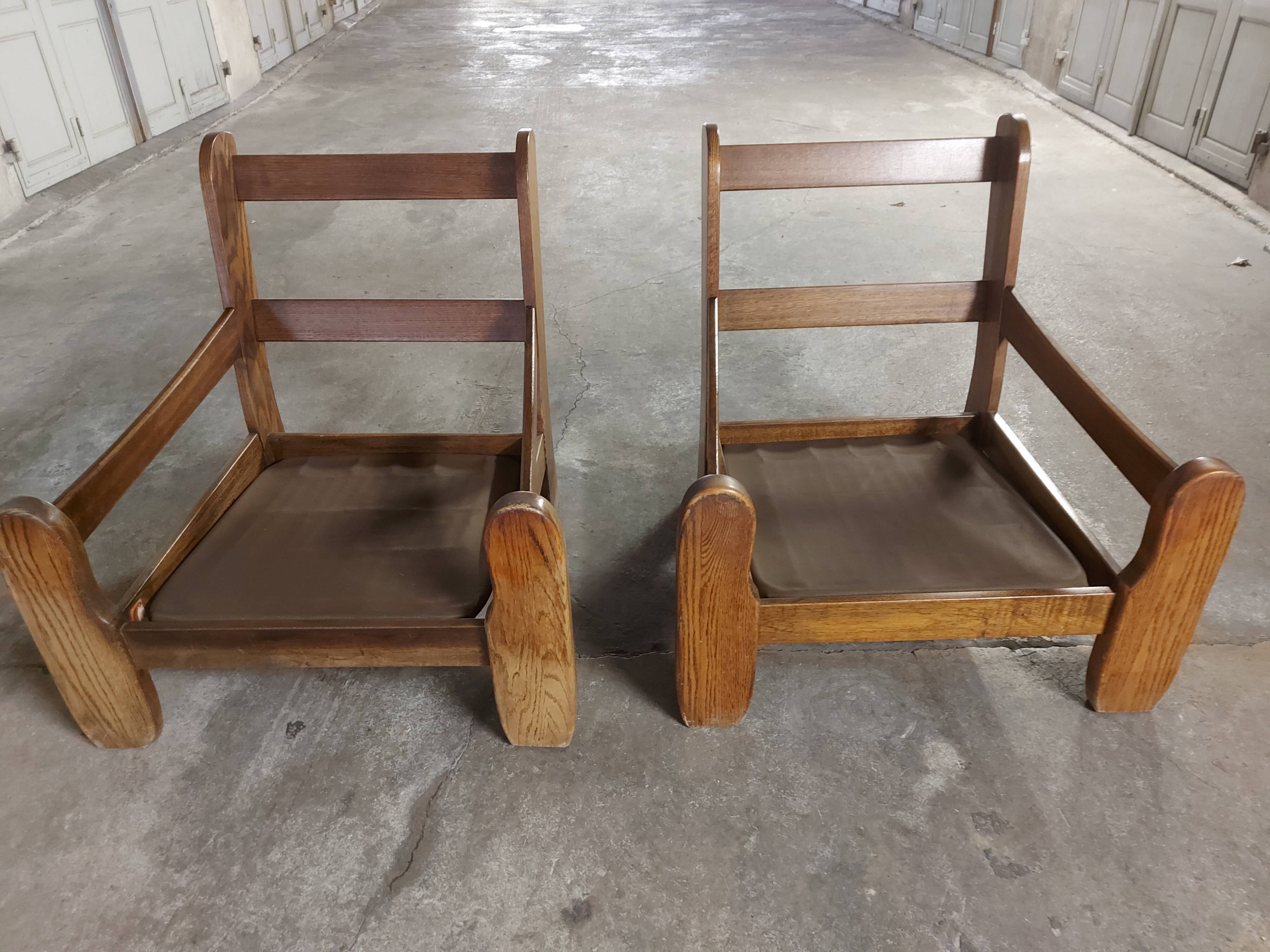 Armchairs in leather and vintage wood 70's
