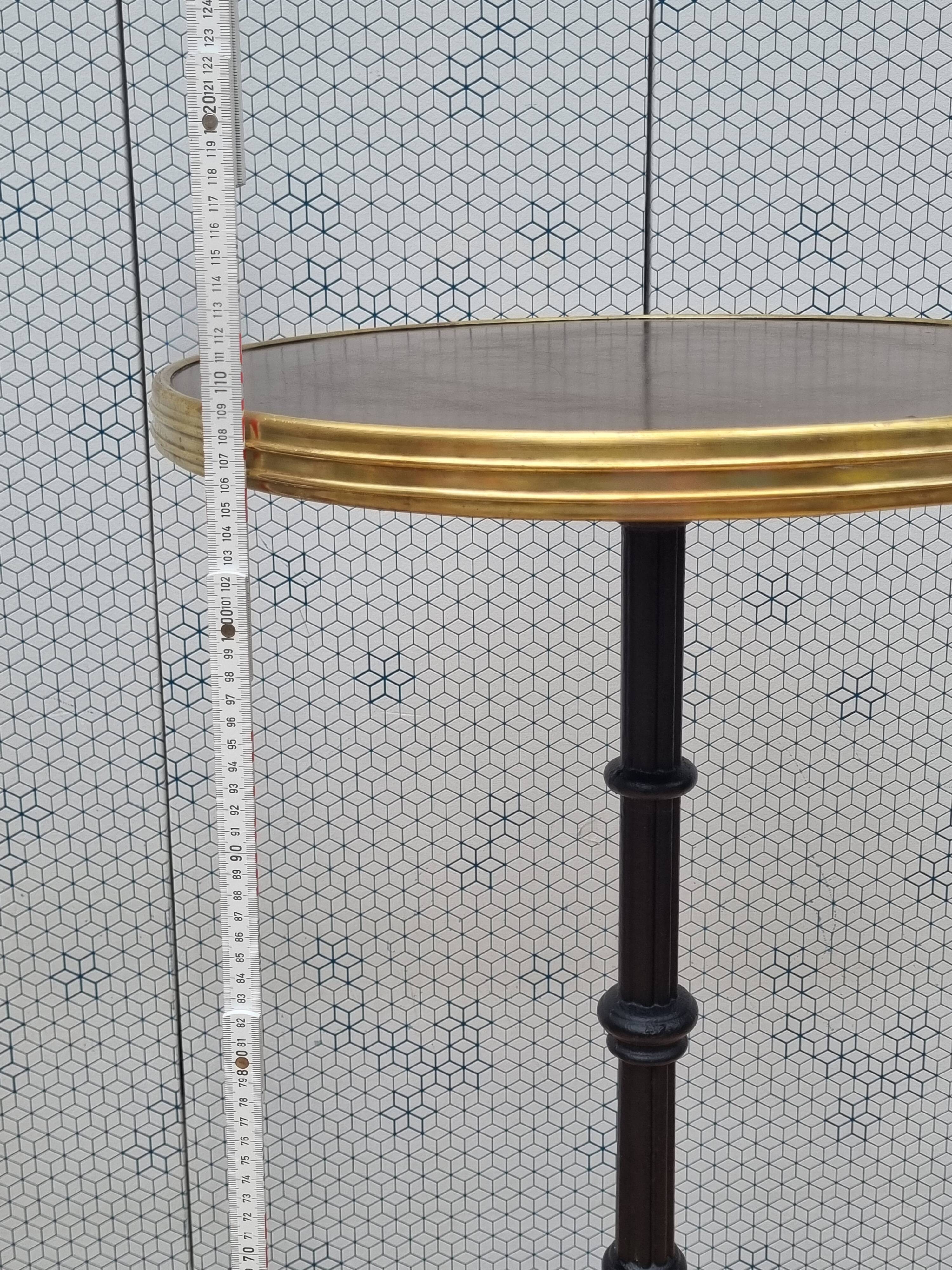Vintage cast iron and brass "standing" bistro table, 109 cm