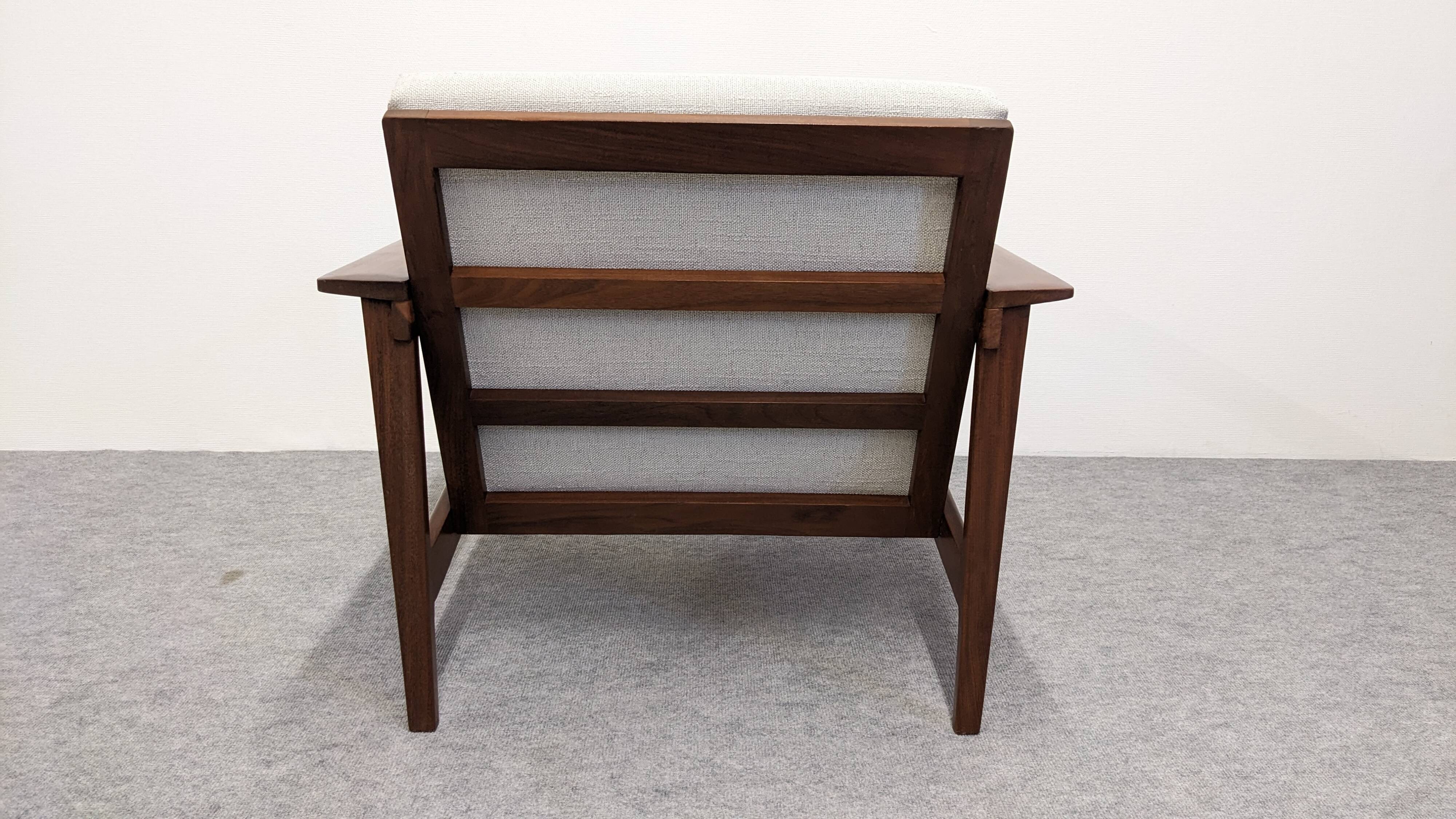 Pair of Scandinavian style armchairs in teak, France circa 1950.