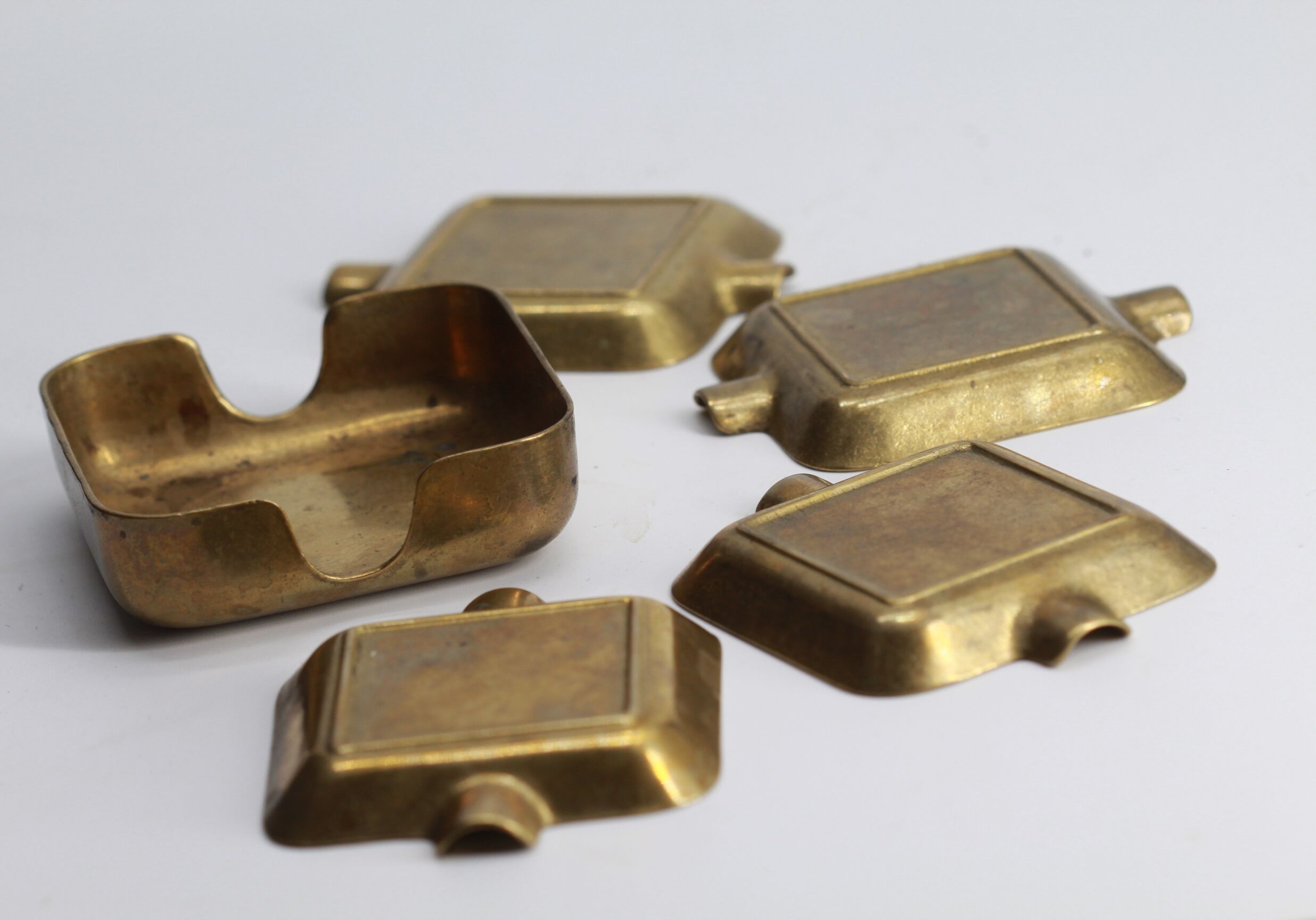 Set of 5 brass ashtrays