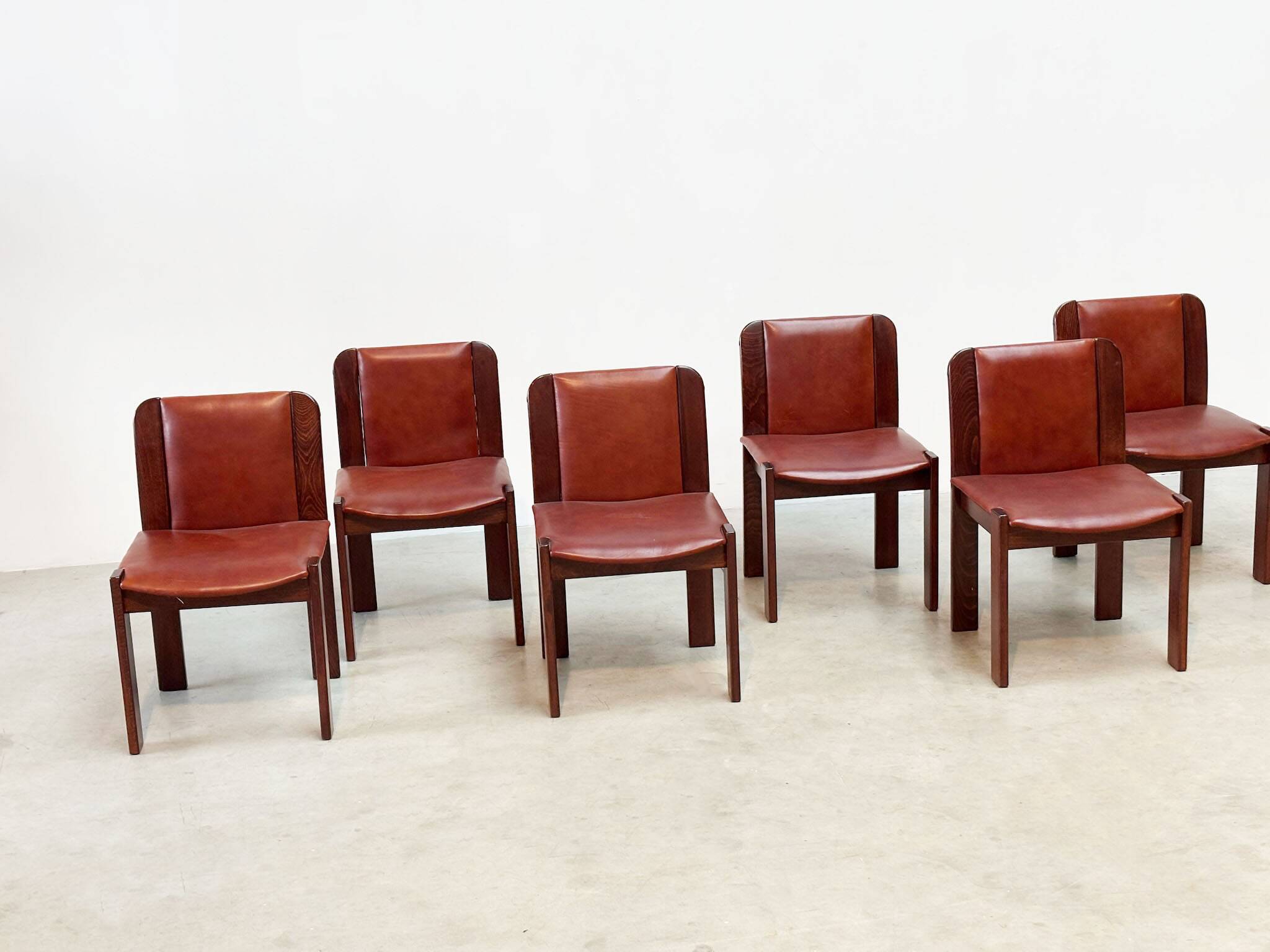 Set of six leather Italian dining chairs