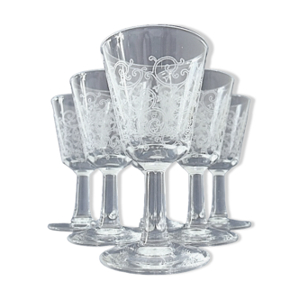 Suite of six conical liquor glasses on printed pattern glass stand