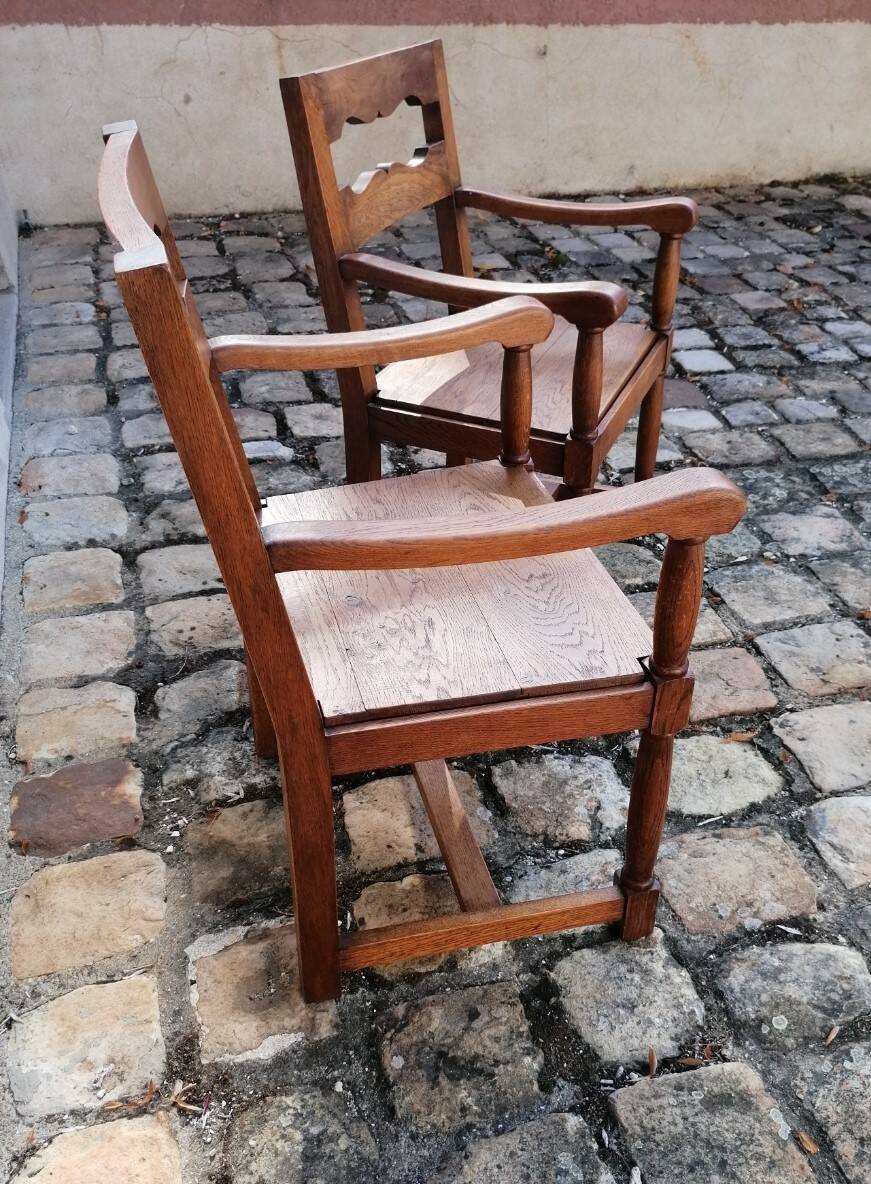 Pair of vintage oak armchairs with geometric design.