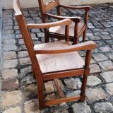 Pair of vintage oak armchairs with geometric design.