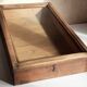 Old sloping pine display case