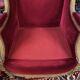 Golden wooden bergère in Louis XVI style upholstered in Bordeaux velvet.