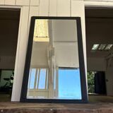 Old mirror with black powdered frame