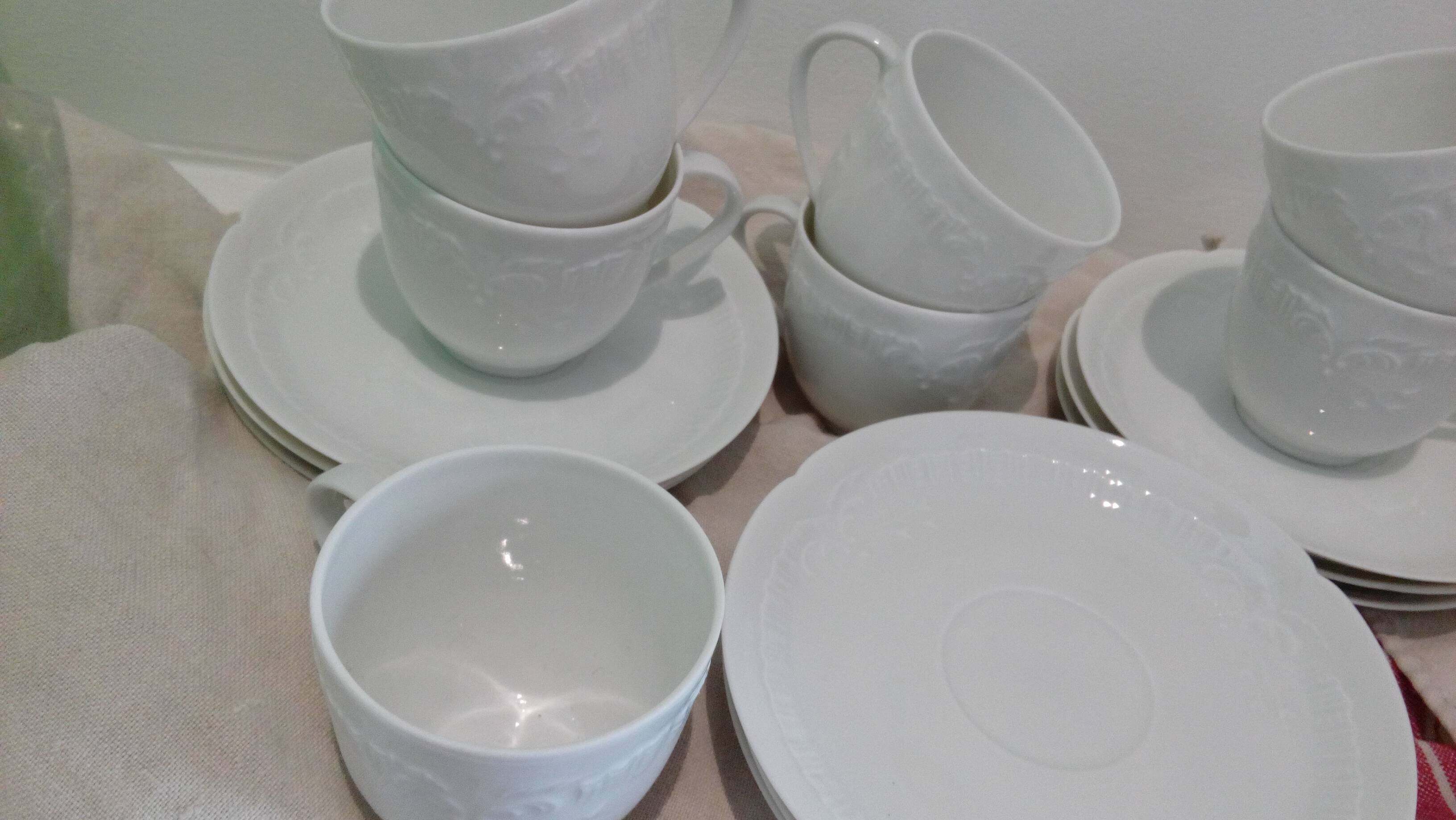 Set of 9 white porcelain coffee cups