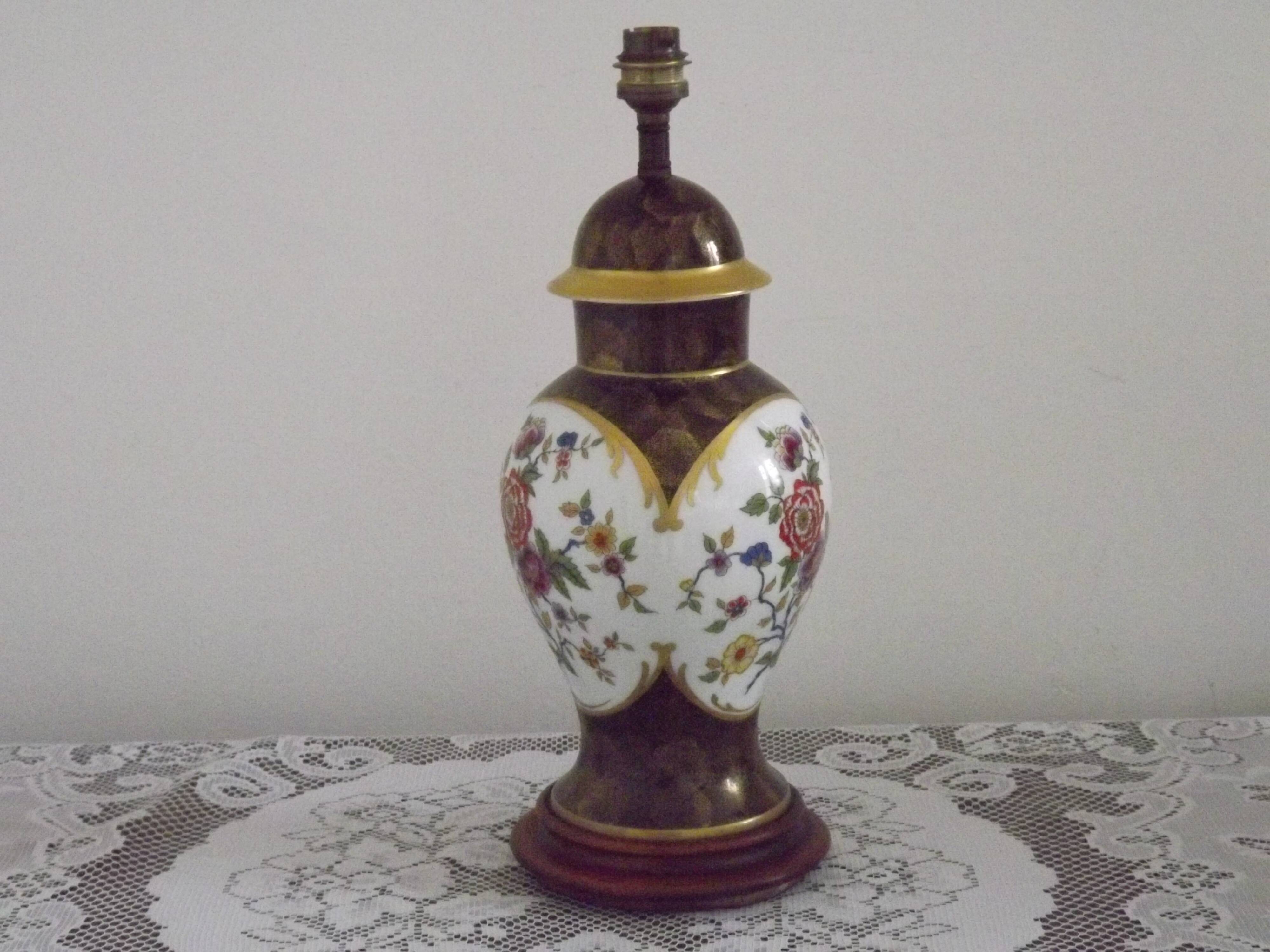 French Limoges Hergé table lamp base with gold highlights and floral decoration.