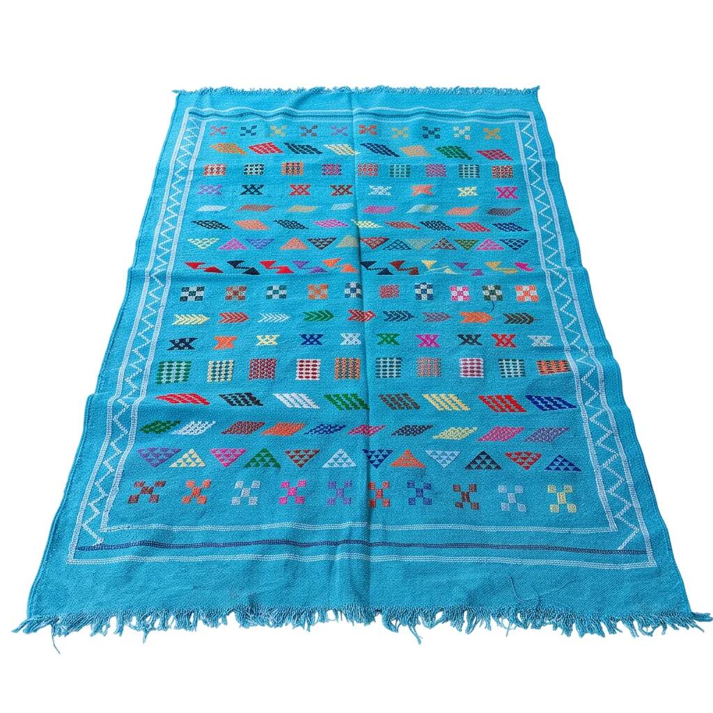 Tapis berbère bleu turquoise motifs multicolores