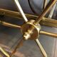Mahogany and brass rolling table in the style of Maison Jansen.