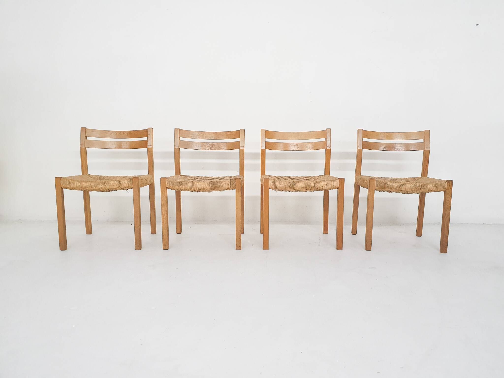 Set of four oak and sisal dining chairs model 401 by JL Moller, Denmark 1970's