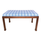 Ottoman coffee table in wood and gingham fabric.
