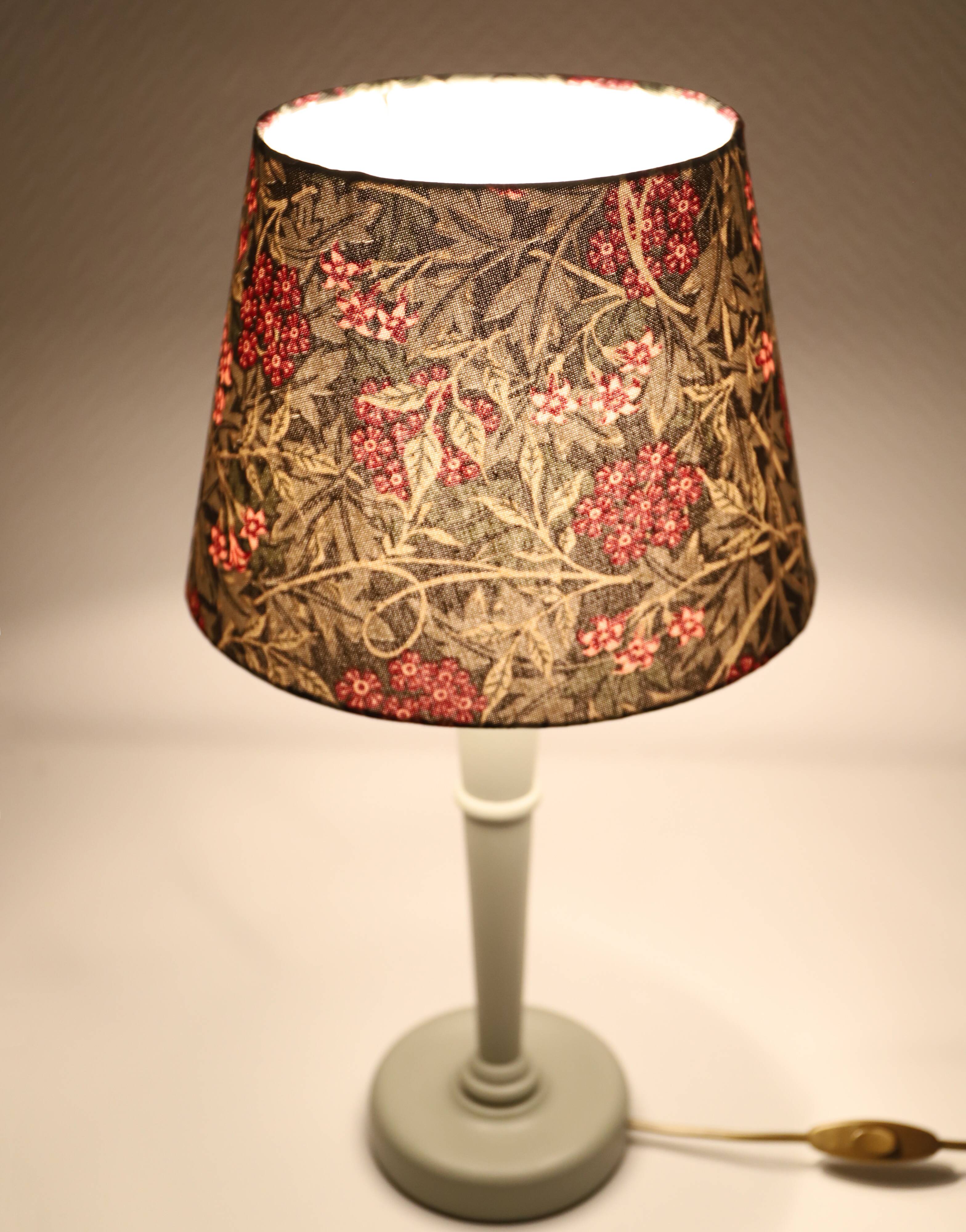 Table lamp, turned wooden base and antique printed lampshade