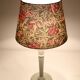 Table lamp, turned wooden base and antique printed lampshade