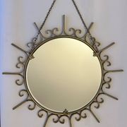 Miroir soleil en métal doré