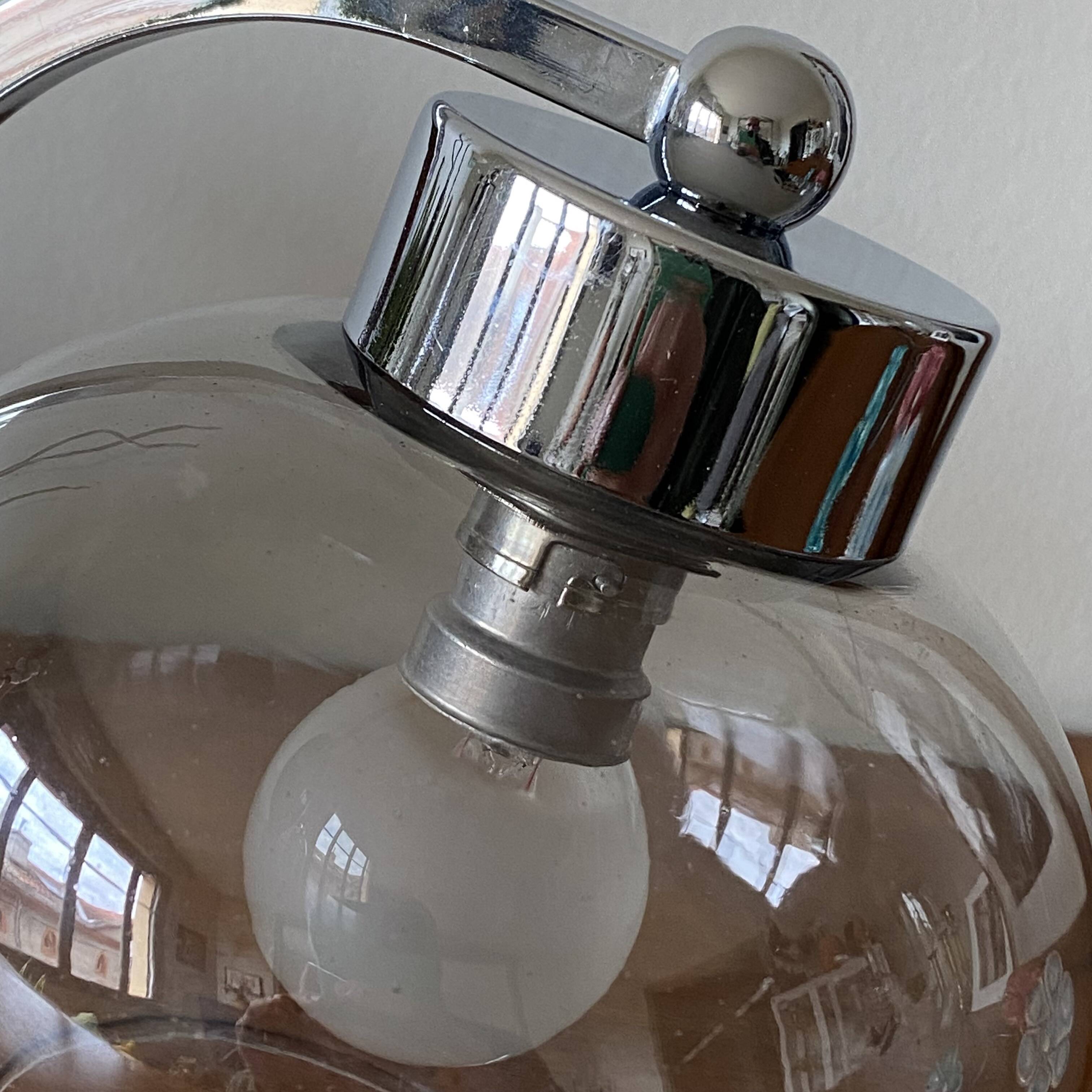 Wall light in chromed metal and smoked grey glass globe
