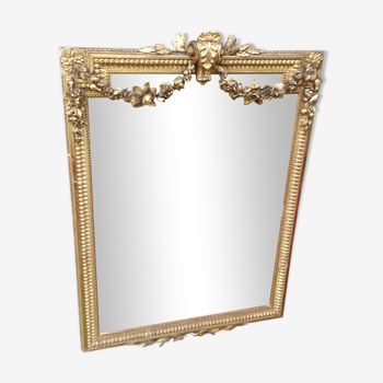 Wooden fireplace mirror and Gilded Louis XVI-style plaster with leaf