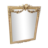 Wooden fireplace mirror and Gilded Louis XVI-style plaster with leaf