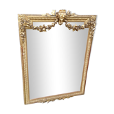 Wooden fireplace mirror and Gilded Louis XVI-style plaster with leaf