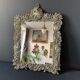 Antique Italian mirror in repoussé silver metal
