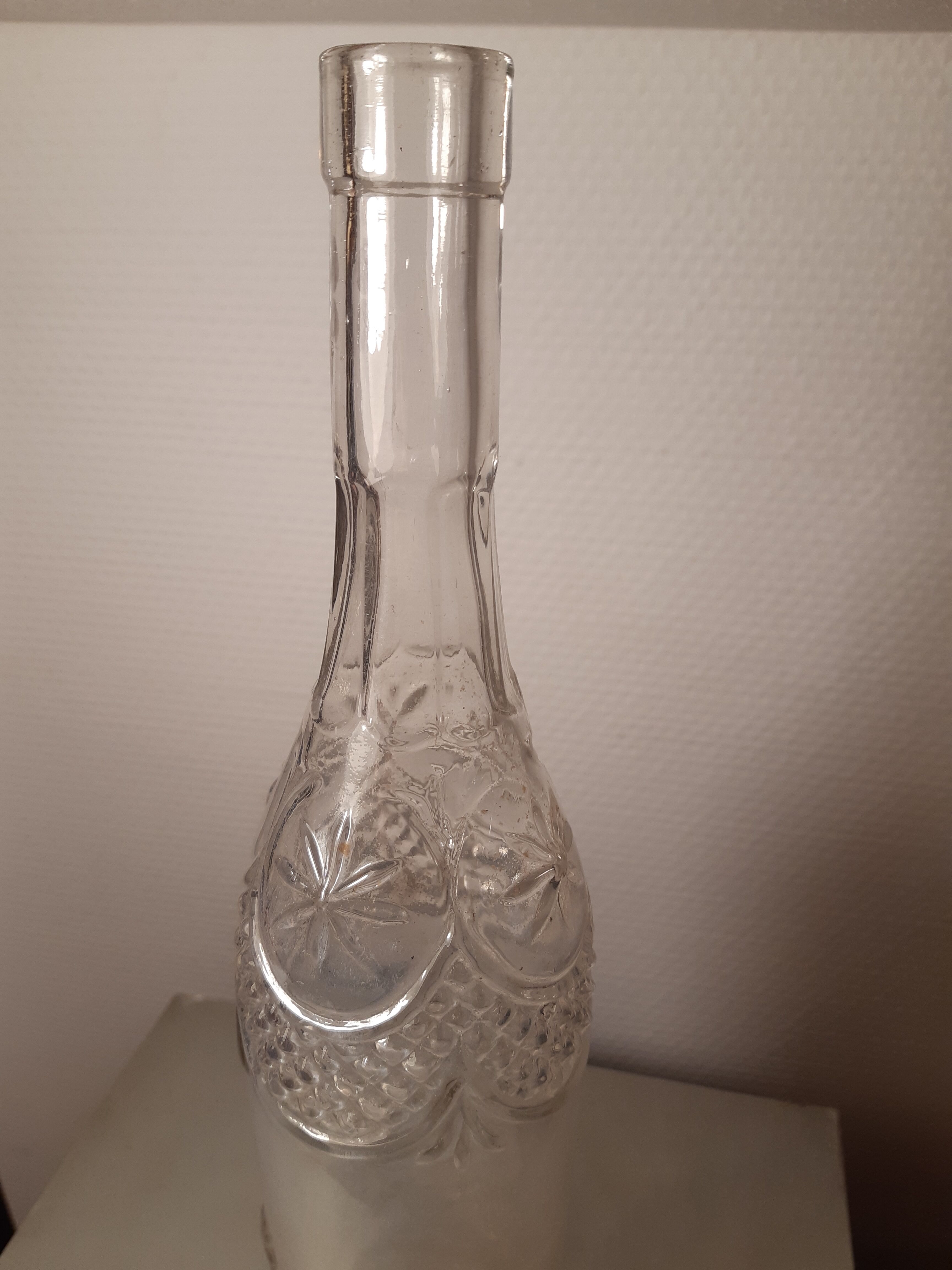 Engraved antique bottle